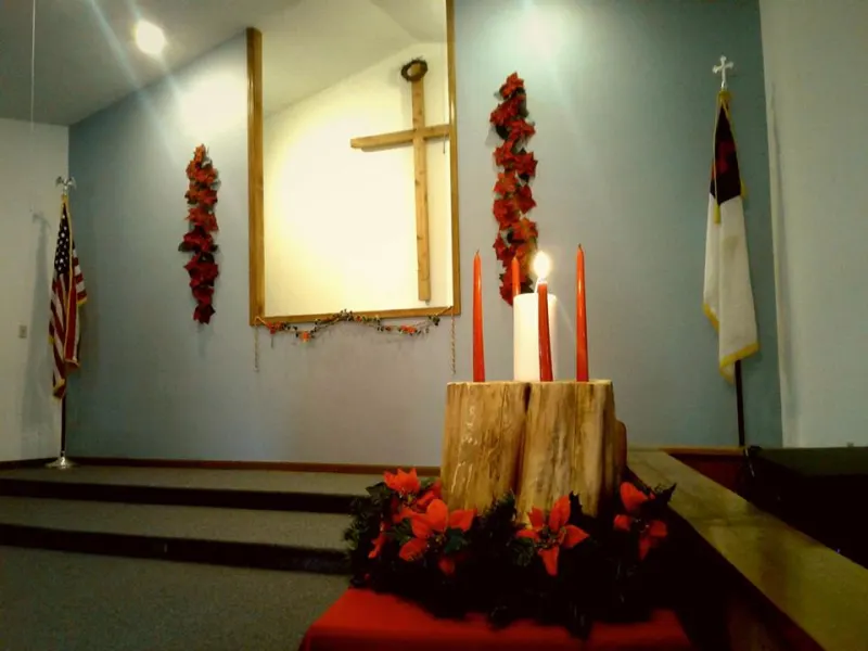 Candles lit at the front of the sanctuary