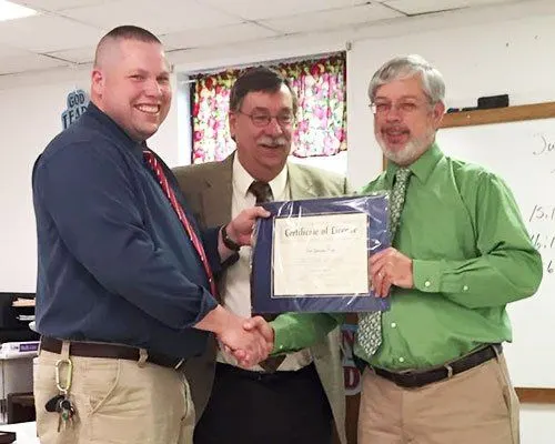 Briarwood elders congratulating a newly ordained minister